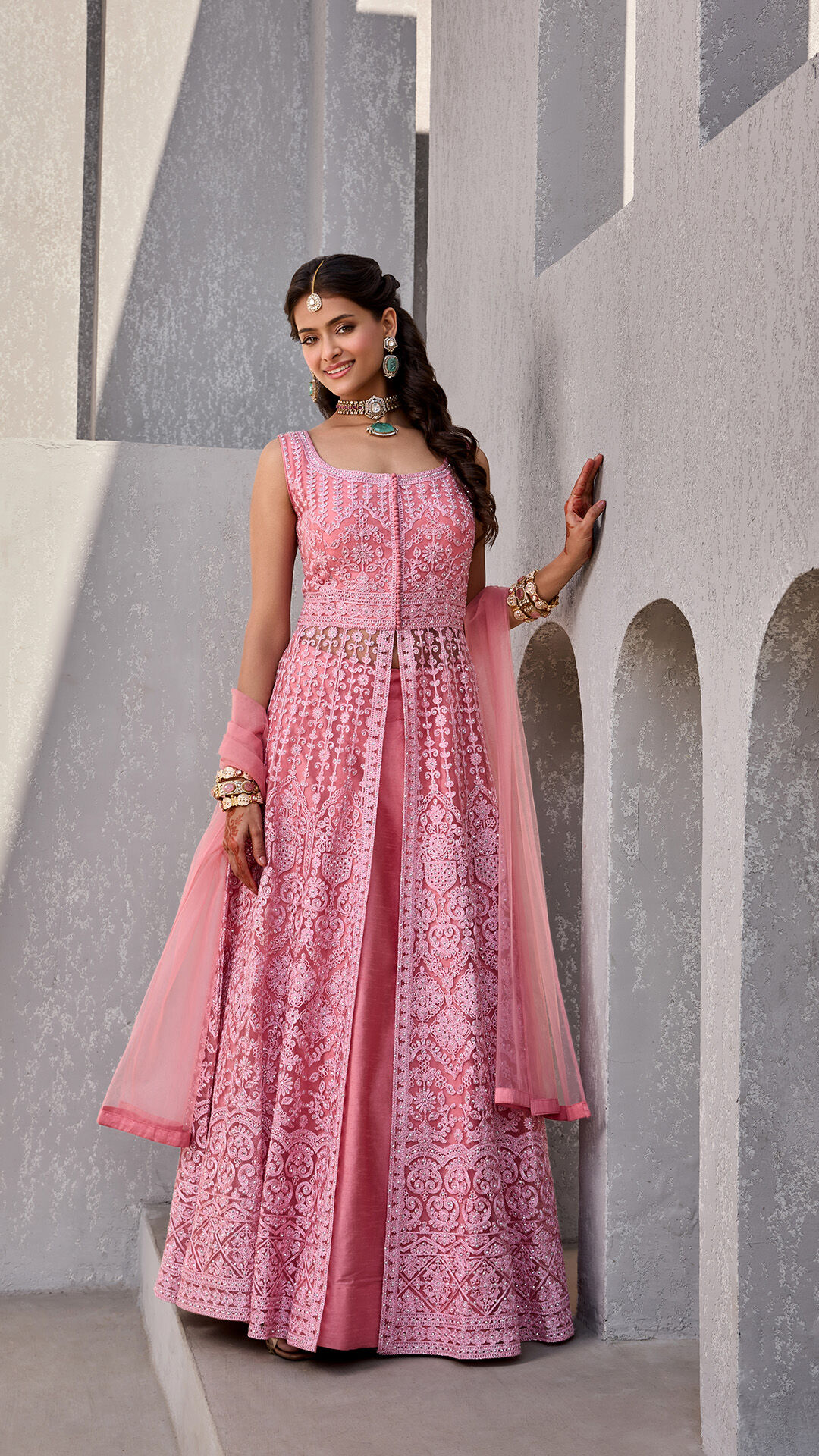 Women wearing beautifulll pink lehenga for wedding event